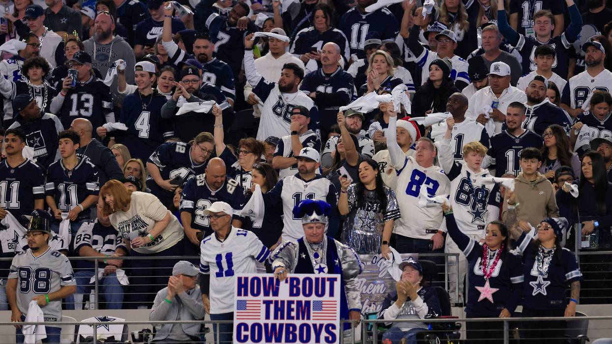 Dallas Cowboys fans cheer during the fourth quarter in the game against the Detroit Lions at AT&T Stadium on December 30, 2023, in Arlington, Texas.