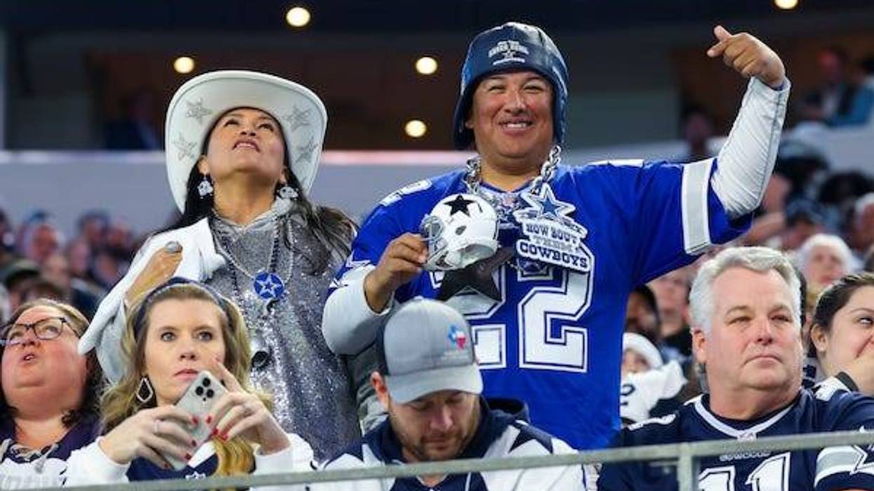 Dallas Cowboys fans cheer during the game against the Detroit Lions at AT&T Stadium