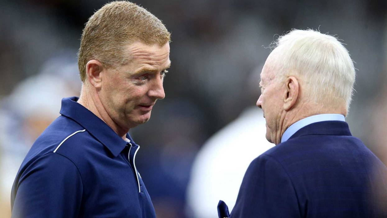 Dallas Cowboys head coach Jason Garrett talks to team owner Jerry Jones