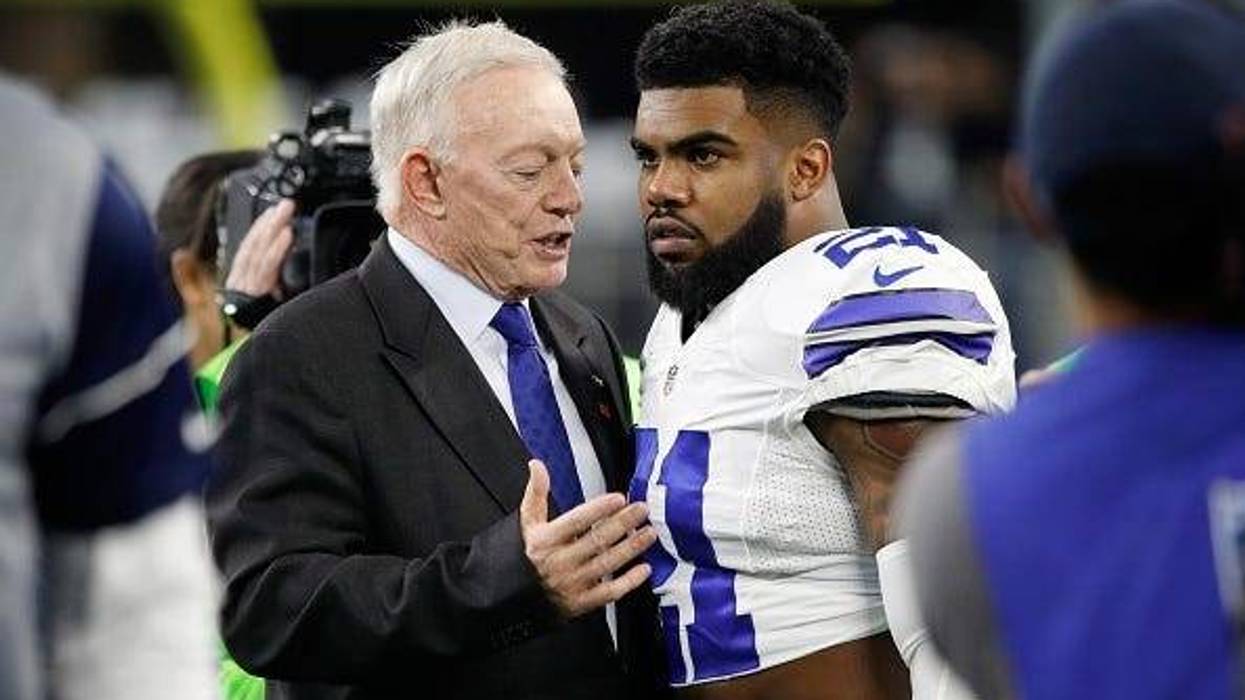 Dallas Cowboys owner Jerry Jones talks with Ezekiel Elliott #21 of the Dallas Cowboys before the NFC Divisional Playoff Game against the Green Bay Packers at AT&T Stadium on January 15, 2017 in Arlington, Texas.