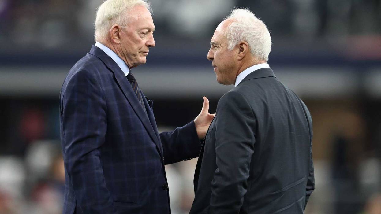Dallas Cowboys owner Jerry Jones talks with Philadelphia Eagles owner Jeffrey Lurie