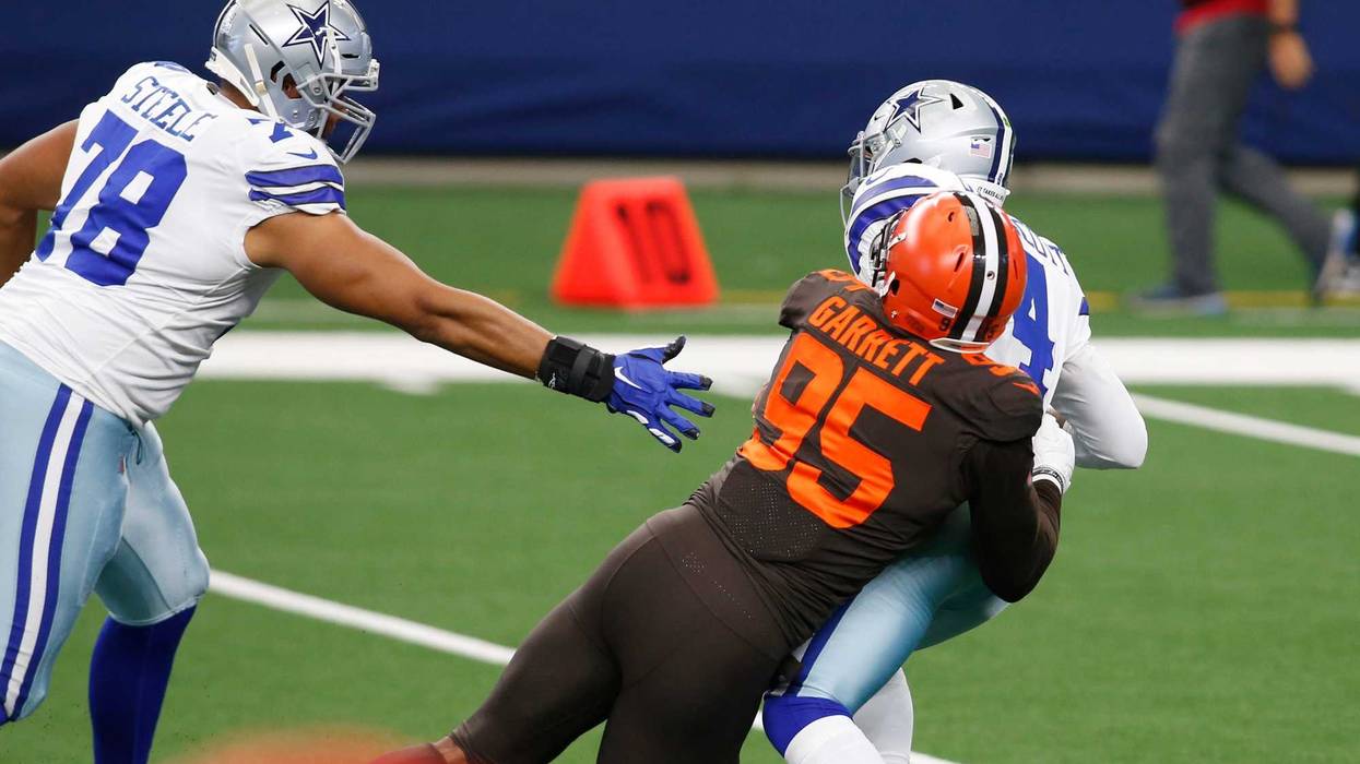 Dallas Cowboys quarterback Dak Prescott is sacked by Cleveland Browns defensive end Myles Garrett