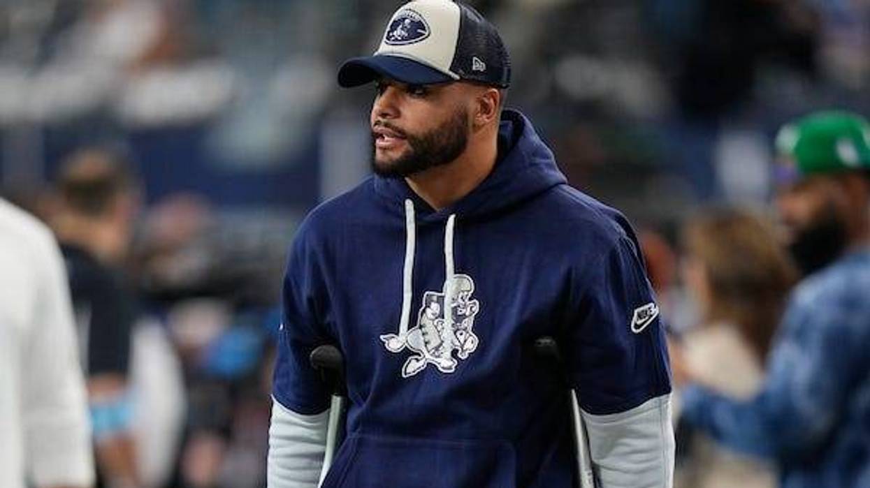 Dallas Cowboys quarterback Dak Prescott stands on crutches before the game against the New York Giants at AT&T Stadium
