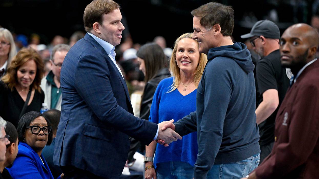 Dallas Mavericks governor Patrick Dumont (left) talks with Mark Cuban (right) during the first quarter of the game between the Mavericks and the Washington Wizards at the American Airlines Center.