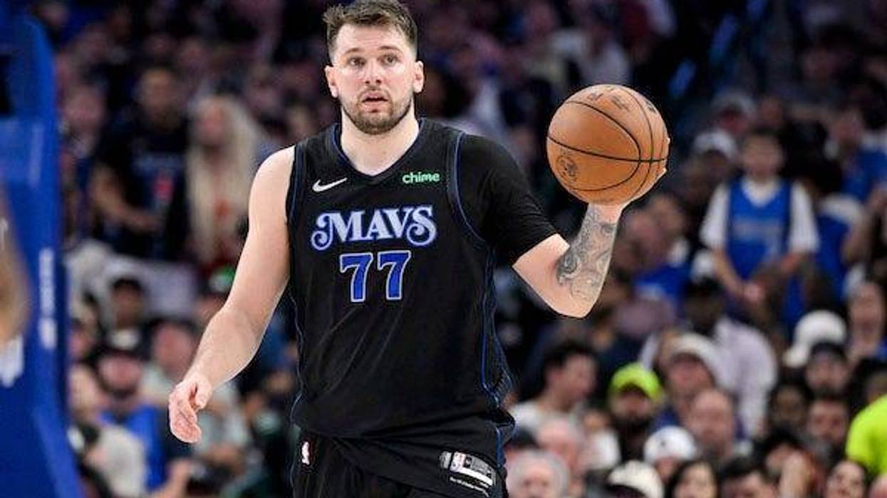 Dallas Mavericks guard Luka Doncic (77) brings the ball up court against the LA Clippers during the third quarter during game six of the first round for the 2024 NBA playoffs at American Airlines Center