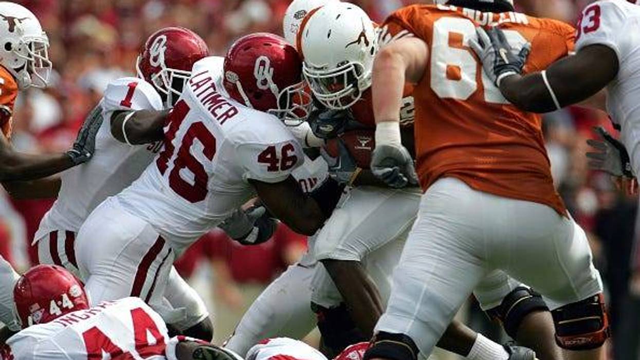 DALLAS - OCTOBER 8: Running back Jamaal Charles #25 of the Texas Longhorns breaks away from Zach Latimer #46 of the Oklahoma Sooners and runs for a touchdown on October 8, 2005 at the Cotton Bowl in Dallas, Texas.