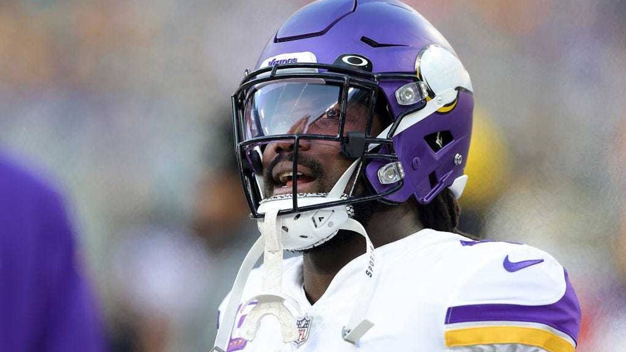 Dalvin Cook #4 of the Minnesota Vikings watches action prior to a game against the Green Bay Packers at Lambeau Field on January 01, 2023 in Green Bay, Wisconsin.