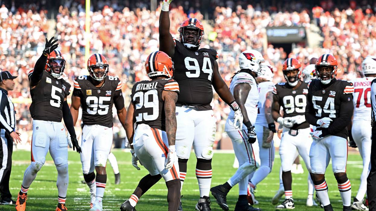 Dalvin Tomlinson #94 of the Cleveland Browns celebrates a sack against the Arizona Cardinals during the first half of the game at Cleveland Browns Stadium on November 05, 2023 in Cleveland, Ohio.