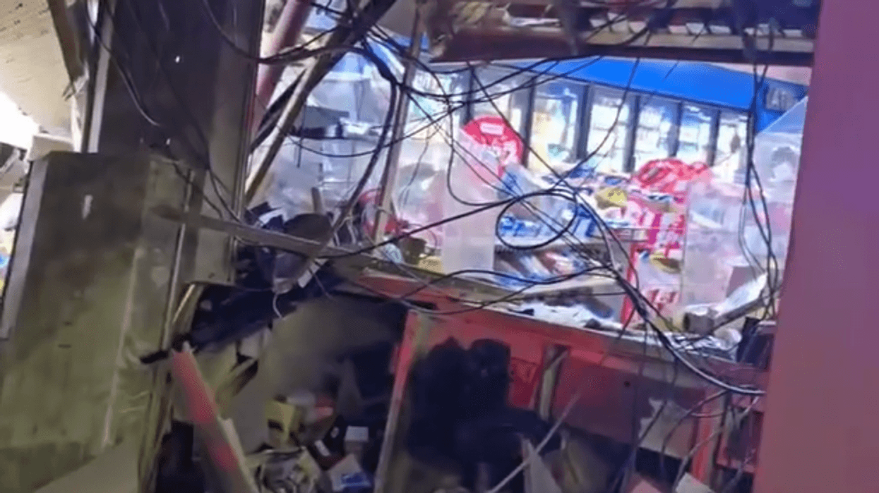 Damage to Detroit gas station after crash.