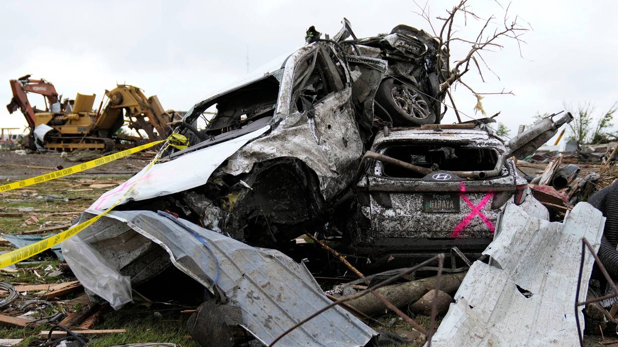 Damaged cars sit piled up