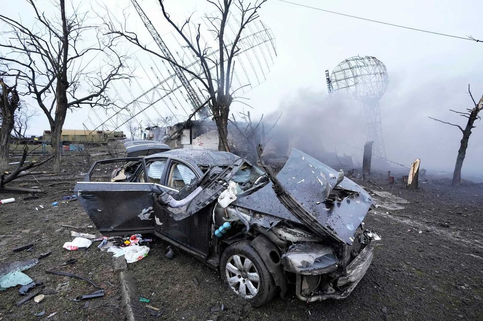 Damaged radar, a vehicle and equipment are seen at a Ukrainian military facility outside Mariupol, Ukraine, Thursday, Feb. 24, 2022