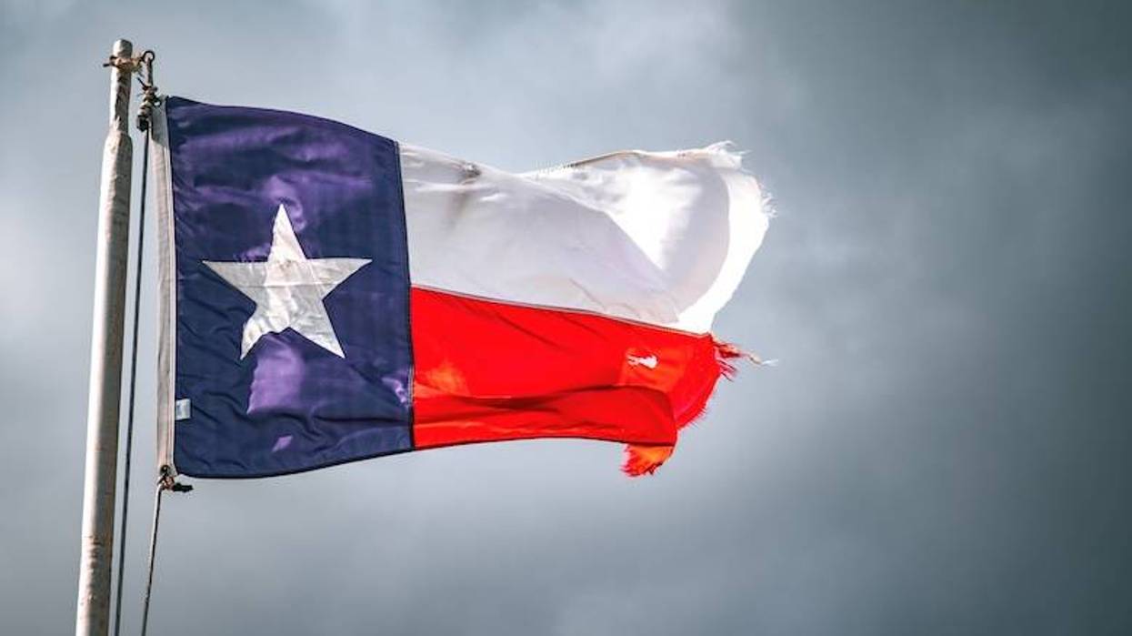 Damaged Texas flag flying in the wind