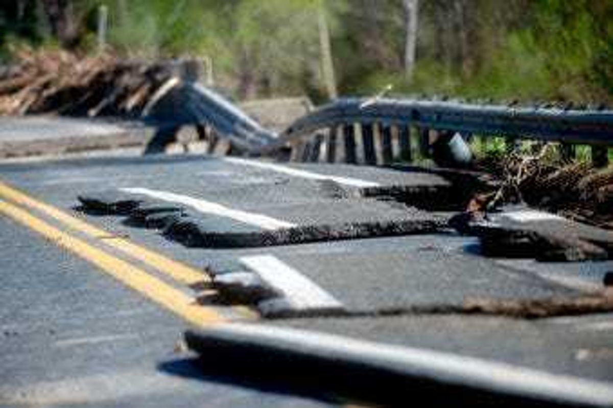 Damages on one of two North M-30 bridges on Wednesday, May 20, 2020 in Edenville Township north of Midland. (Jake May/The Flint Journal, MLive.com via AP)