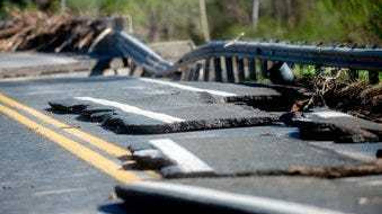 Damages on one of two North M-30 bridges on Wednesday, May 20, 2020 in Edenville Township north of Midland. (Jake May/The Flint Journal, MLive.com via AP)