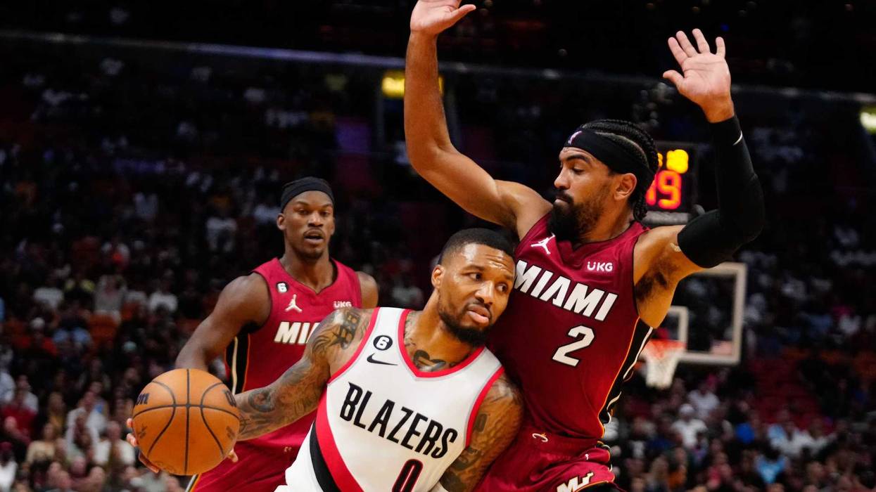 Damian Lillard drives past Miami Heat guard Gabe Vincent