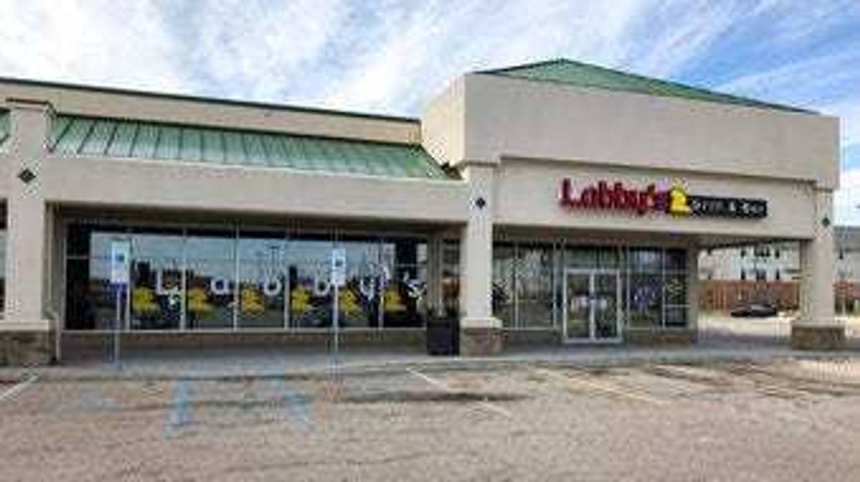 Dan Labernik, owner of Labby's Grill and Bar in Fargo, N.D., is seen on Tuesday, April 28, 2020. The establishment has been closed to customers for six weeks. (AP Photo/Dave Kolpack)