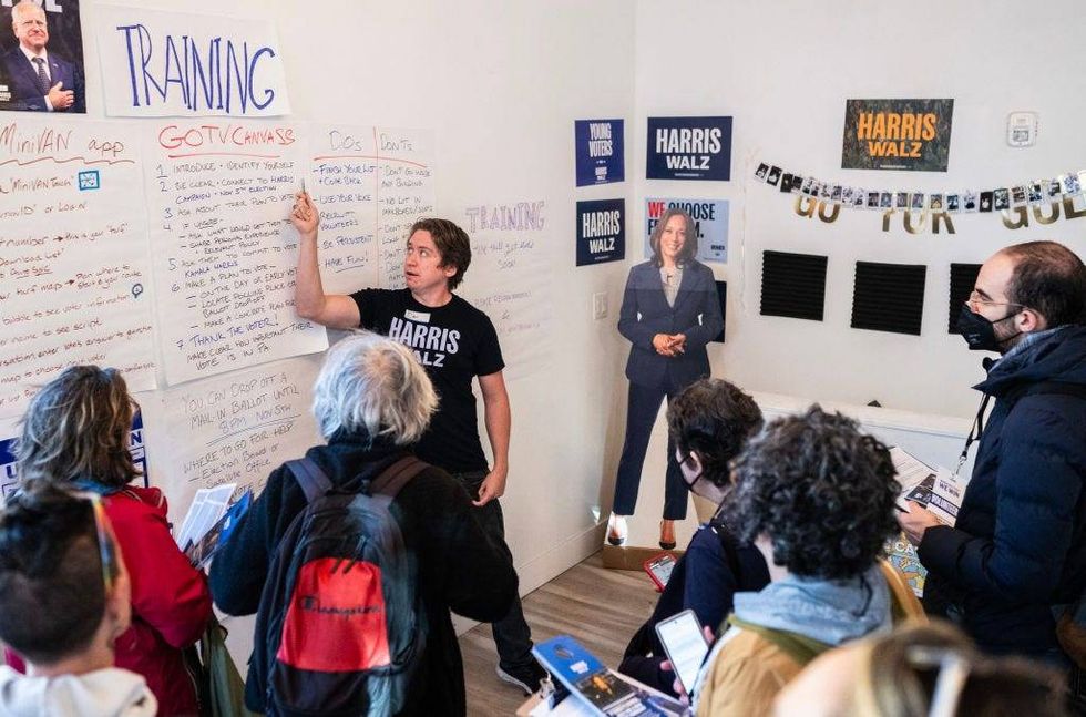 Dan Mariano leads a door-knocking training for Kamala Harris campaign volunteers two days before Election Day in Philadelphia.