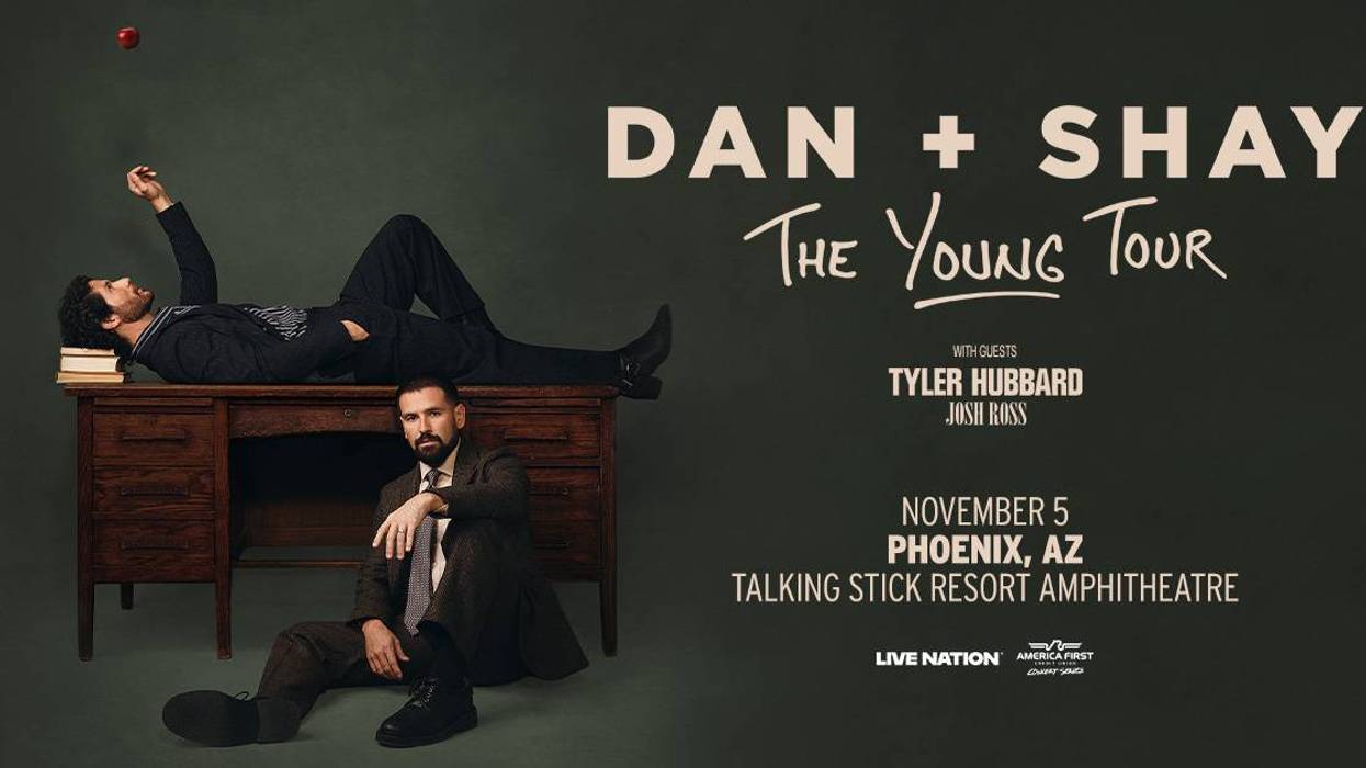 Dan + Shay "The Young Tour" poster. Two men pose with a desk and floating red apple. Phoenix, Nov 5.