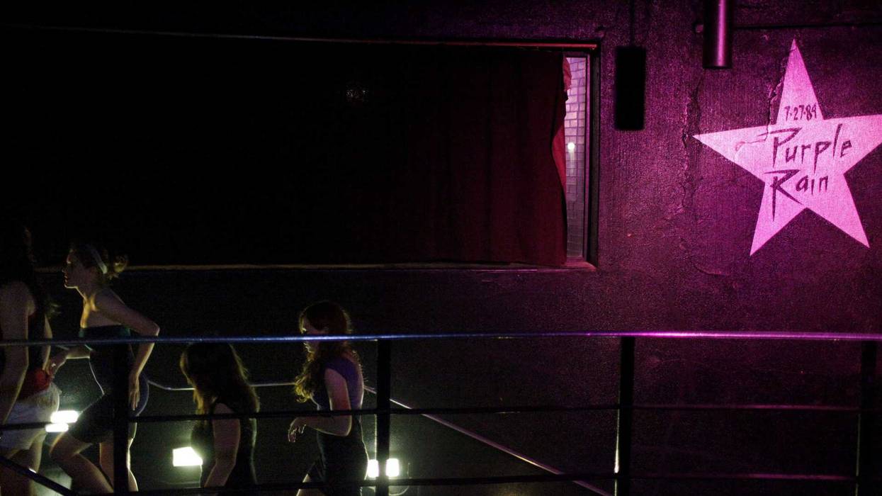 Dancegoers make their way up the stairs under the star of "Purple Rain," July 17, 2009, at First Avenue during the "Let's Go Crazy" dance party to mark the 25th anniversary of "Purple Rain," which was filmed largely at the Minneapolis night club.