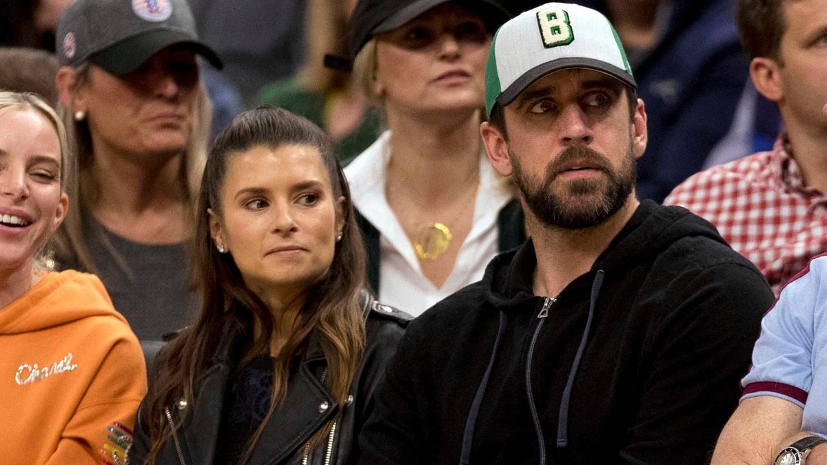 Danica Patrick and Aaron Rodgers take in the Milwaukee Bucks' Game 5 win over the Boston Celtics.