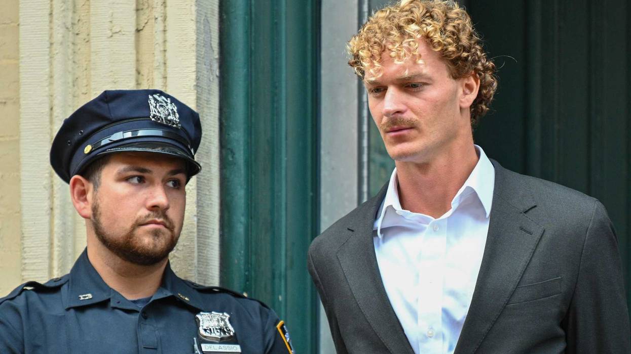 Daniel Penny is escorted in handcuffs by the NYPD after turning himself into the 5th Precinct on May 12, 2023