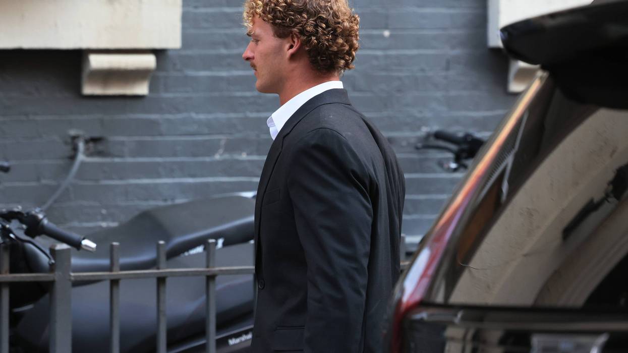 Daniel Penny walks into the 5th Precinct stationhouse on May 12, 2023