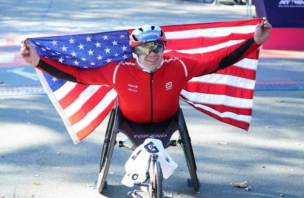 Daniel Romanchuk of the US celebrates after crossing the finish line to win the men