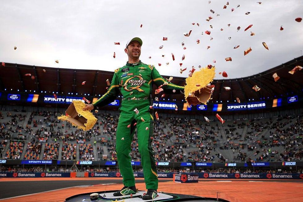 Daniel Suarez, driver of the #9 Quaker State Chevrolet, celebrates with a pinata after winning the NASCAR Xfinity Series The Chilango 150 at Autodromo Hermanos Rodriguez on June 14, 2025 in Mexico City, Mexico.
