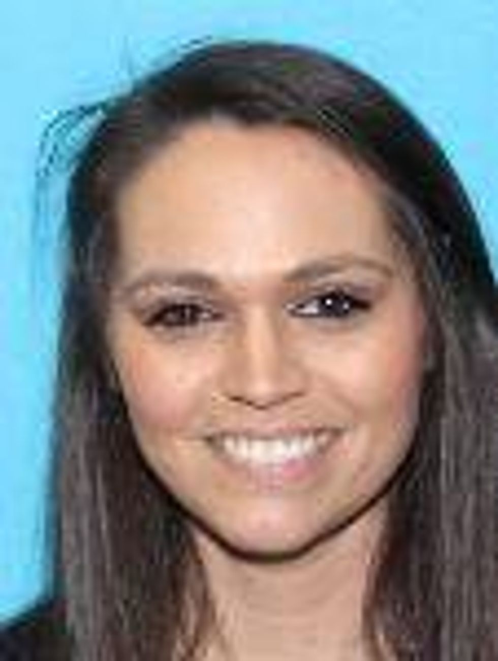 Danielle Banzet. Last seen wearing a long red/white dress with glasses and has long blonde hair (dyed after the DL picture)