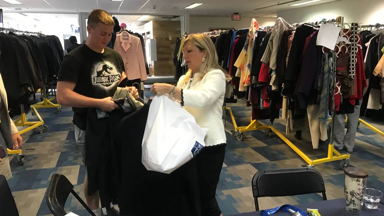 Danielle McNichol, director of Neumann University's center for leadership, helps outfit young people through the "Wardrobes for Work" program.