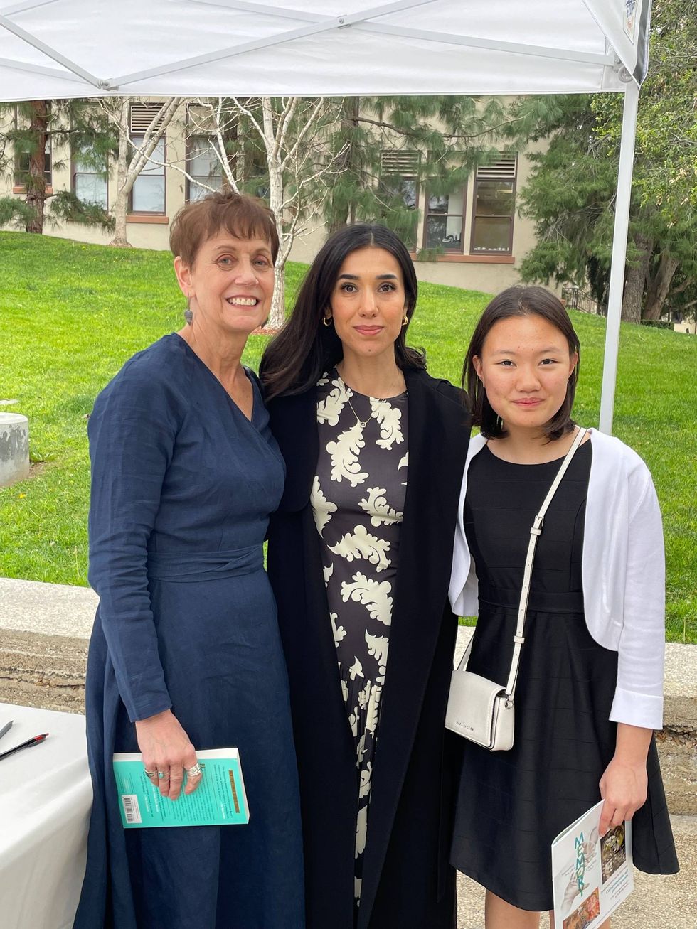 Darcy Blake with a student