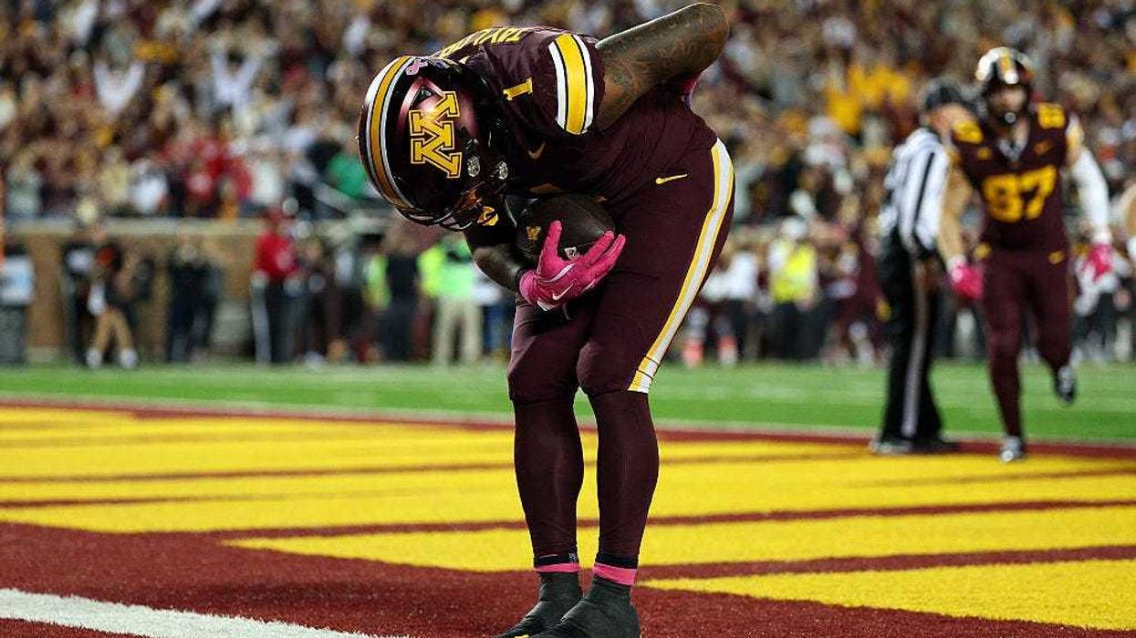 Darius Taylor #1 of the Minnesota Golden Gophers celebrates his touchdown against the Nebraska Cornhuskers in the fourth quarter at Huntington Bank Stadium on October 17, 2025 in Minneapolis, Minnesota. The Golden Gophers defeated the Cornhuskers 24-6.