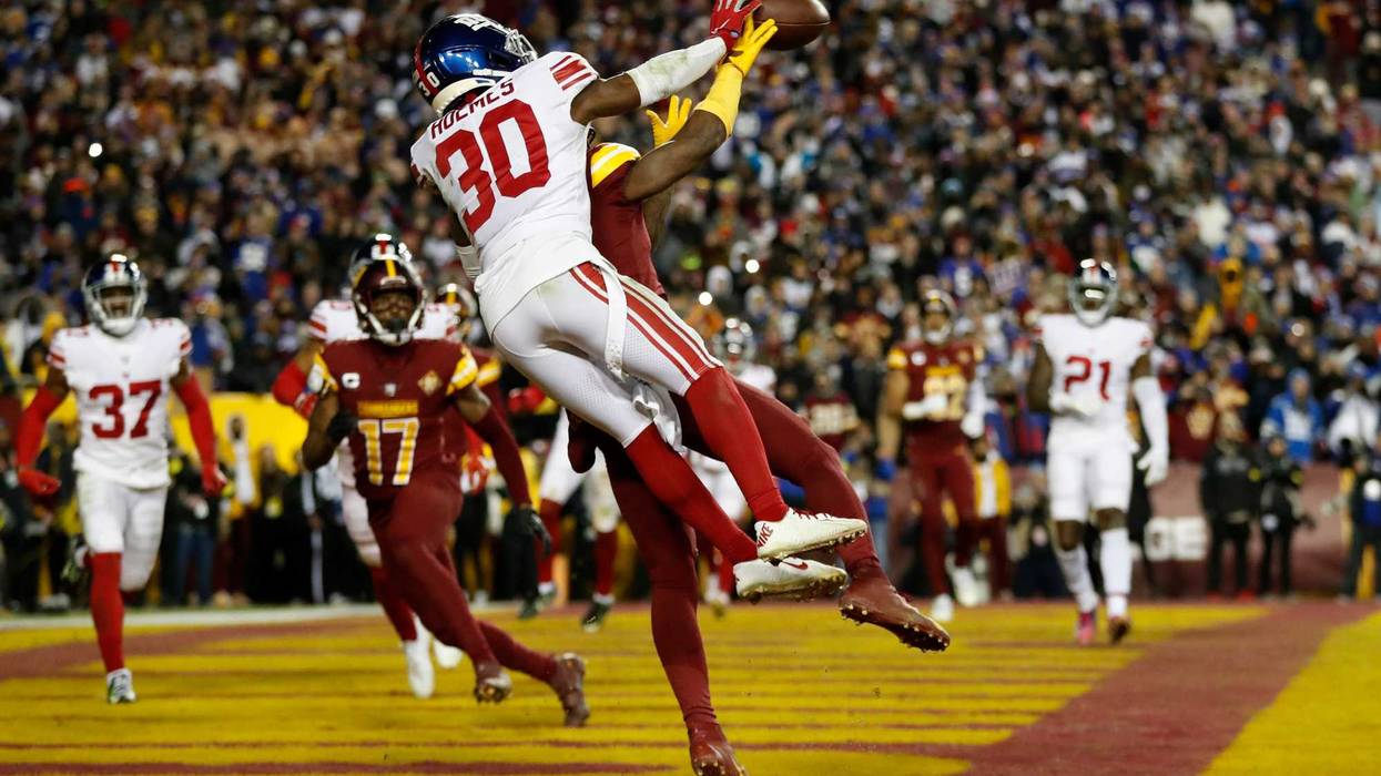 Darnay Holmes of the New York Giants defends against the Washington Commanders' Curtis Samuel and breaks up a pass late during the teams' Week 15 matchup on Dec. 19, 2022.