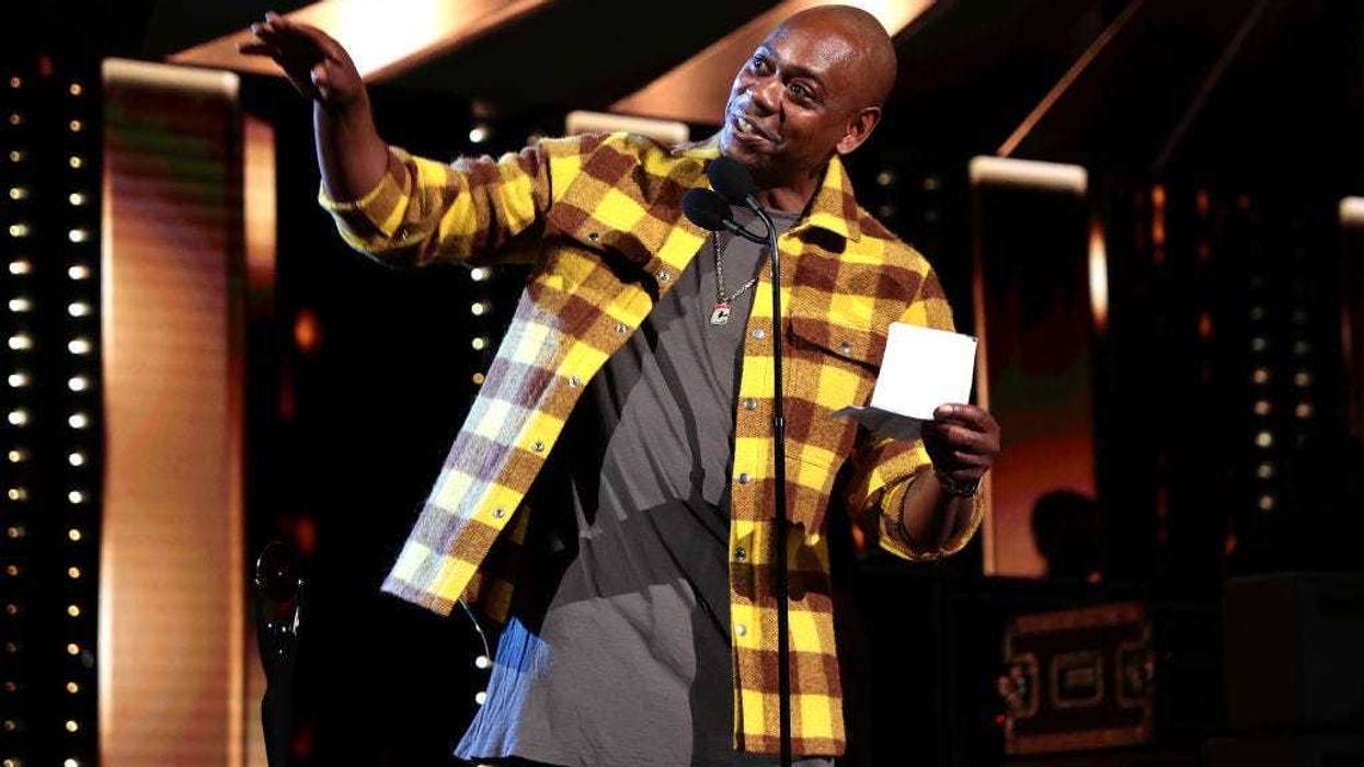 Dave Chappelle speaks onstage during the 36th Annual Rock & Roll Hall Of Fame Induction Ceremony at Rocket Mortgage Fieldhouse on October 30, 2021 in Cleveland, Ohio. (Photo by Dimitrios Kambouris/Getty Images for The Rock and Roll Hall of Fame )