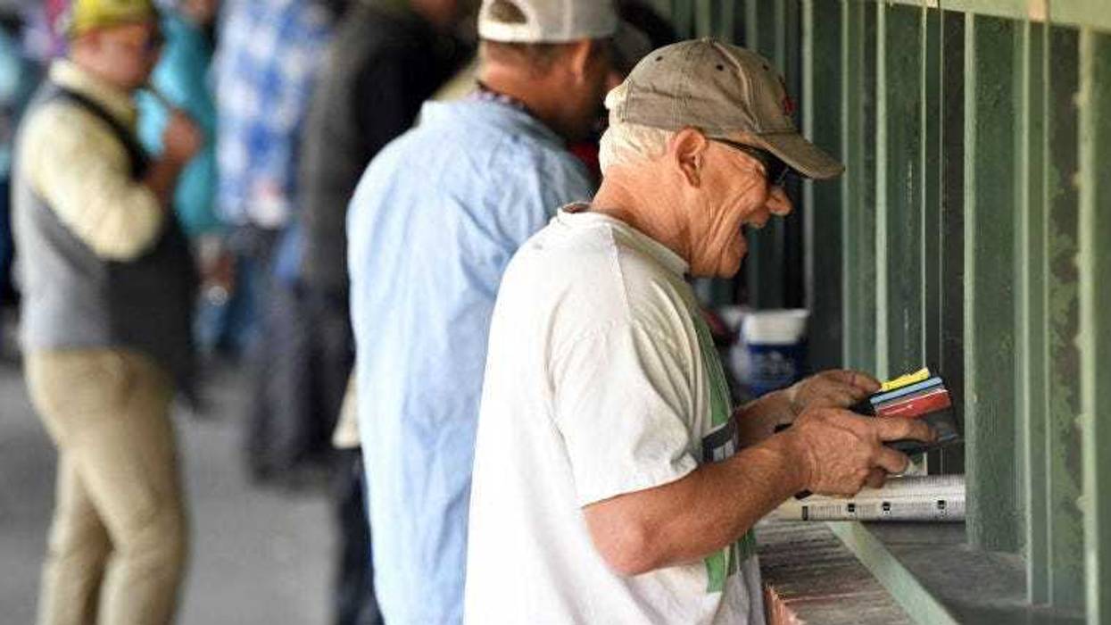 Dave Gambetti places a bet before the 2017 Kentucky Derby at Churchill Downs.