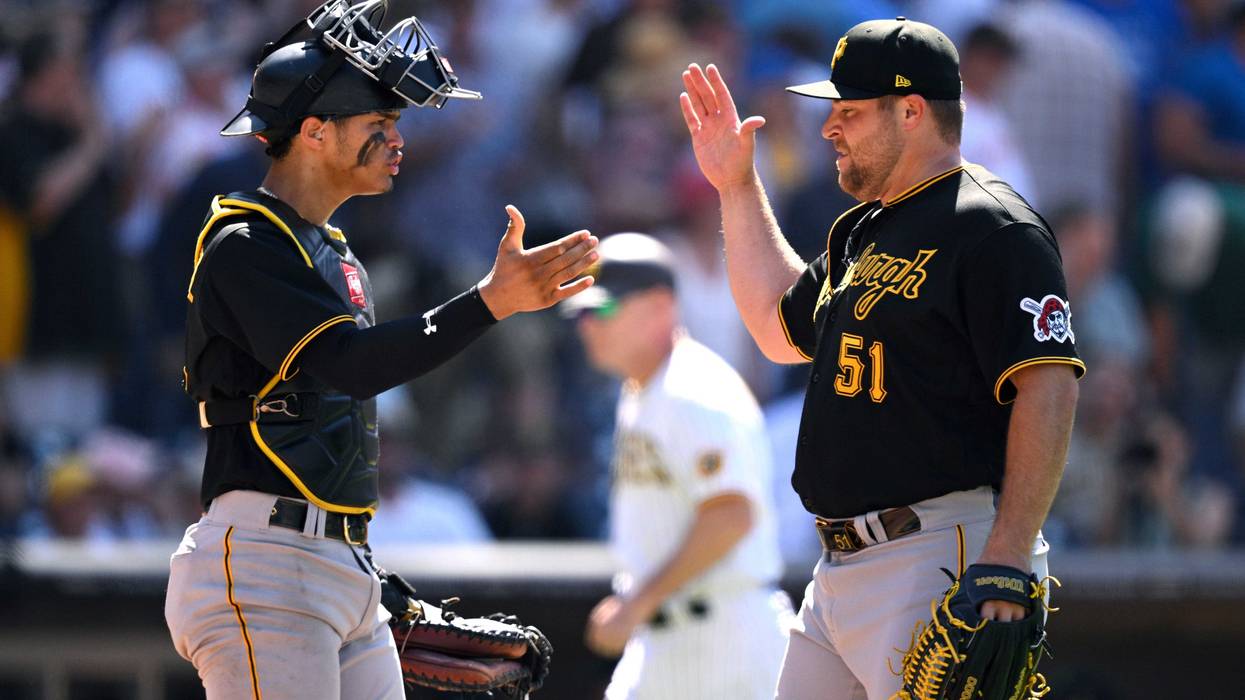 David Bednar and Endy Rodriguez celebrate after defeating the Padres