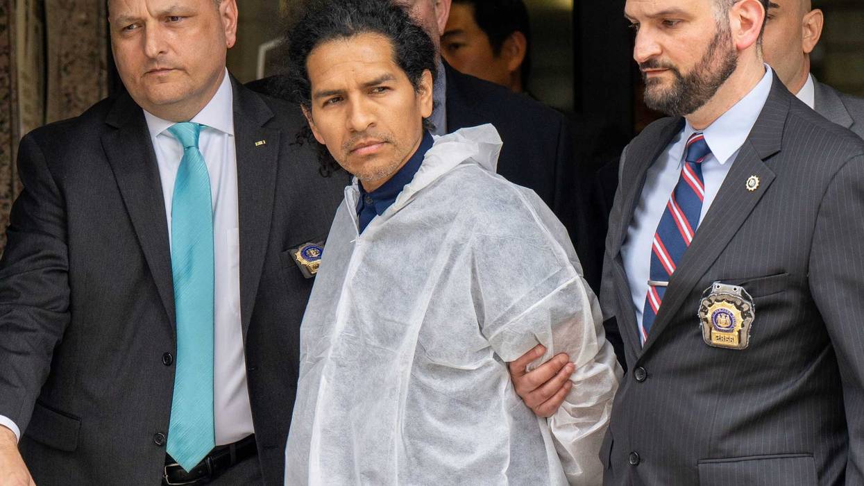 David Bonola, 44, a suspect in the gruesome stabbing of Orsolya Gaal, 51, is taken from the NYPD's 112th Precinct stationhouse in Queens on April 21, 2022