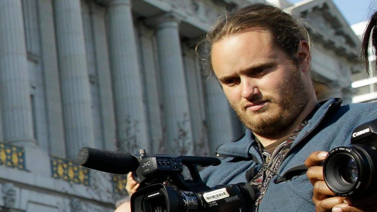 David DePape, right, records the nude wedding of Gypsy Taub outside City Hall on Dec. 19, 2013, in San Francisco.