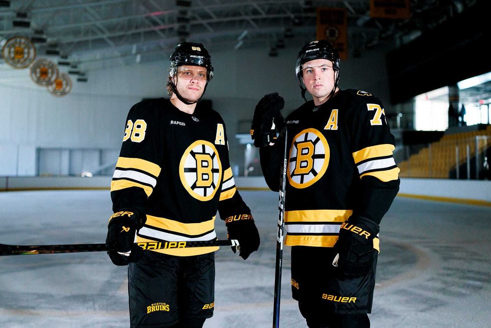 David Pastrnak and Charlie McAvoy model the Bruins