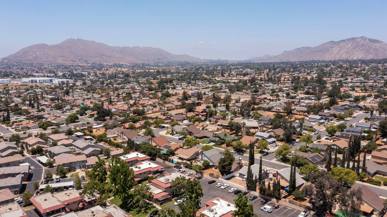 Daytime aerial view of a suburban neighborhood in Moreno Valley, California, USA.