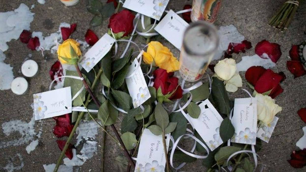 DAYTON, OHIO - AUGUST 06: Flowers bearing the names of those killed in Sunday Morning's mass shooting sits along the sidewalk in the Oregon District on August 06, 2019 in Dayton, Ohio.
