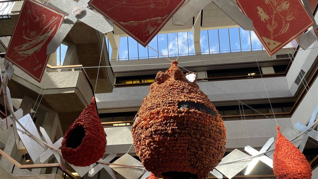 "De Tierra a Estrellas" as it hangs in the atrium of Penn's McNeil Building.