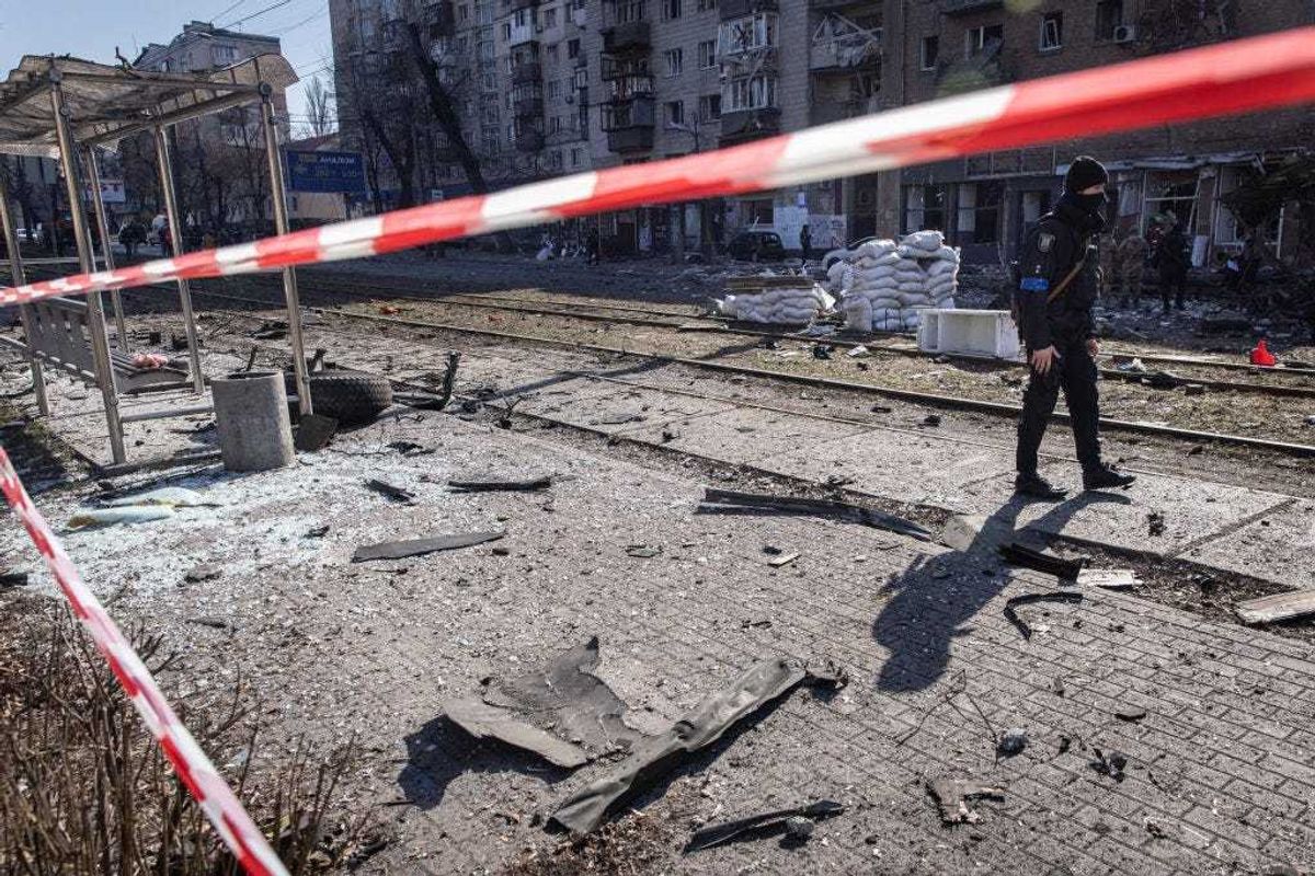 Debris from a damaged residential apartment block caused after a Russian rocket was shot down