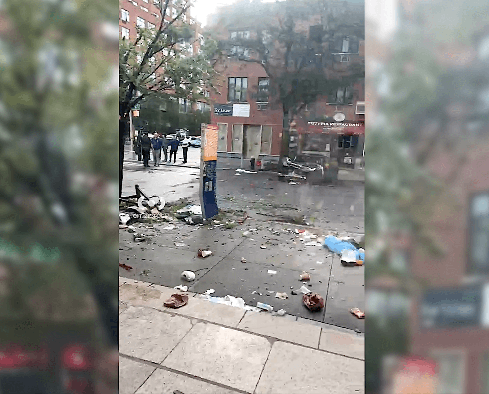 Debris littered the roadway and sidewalk as the NYPD investigated into the morning