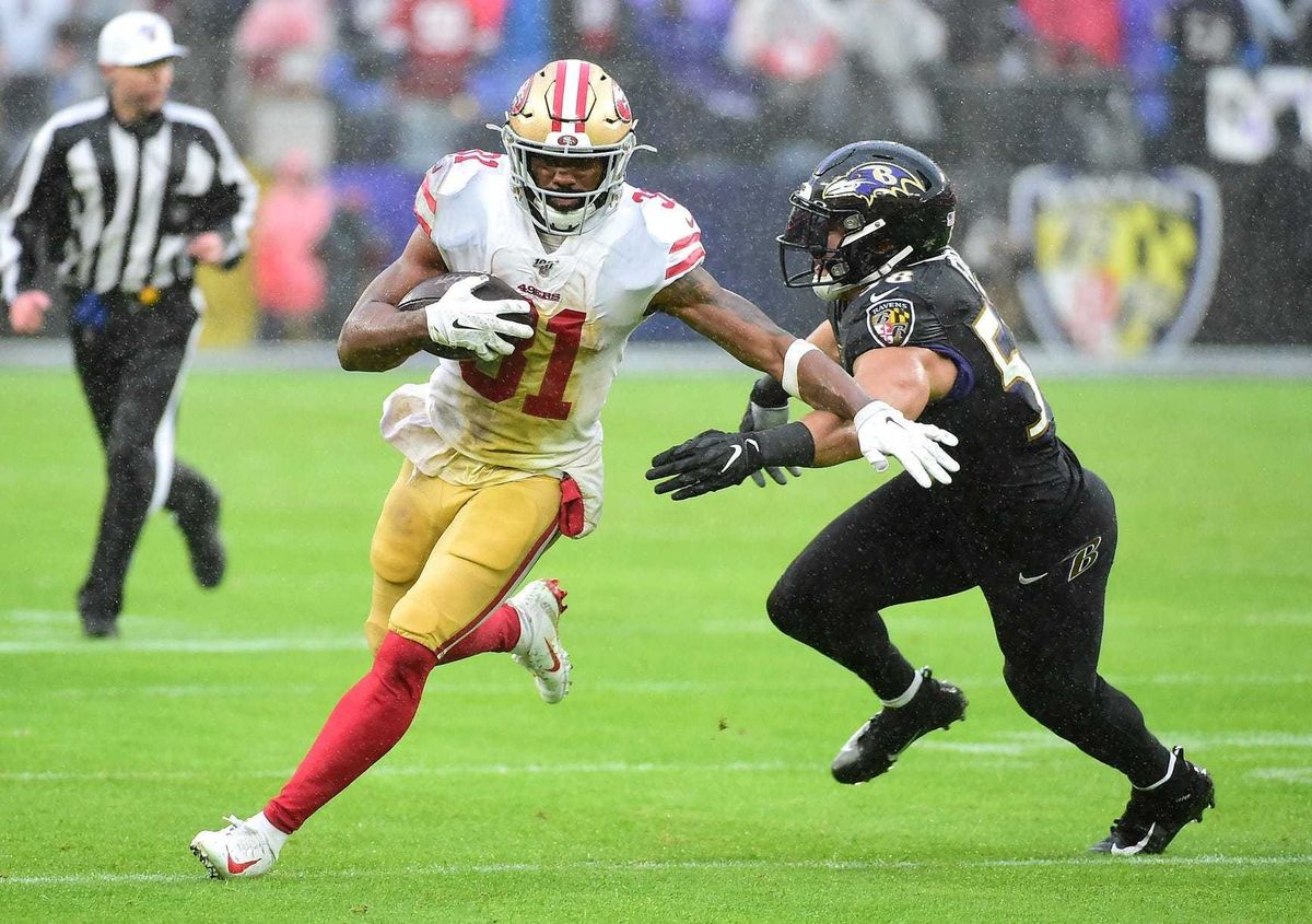 Dec 1, 2019; Baltimore, MD, USA; San Francisco 49ers running back Raheem Mostert (31) runs with the ball while being pursued by Baltimore Ravens linebacker L.J. Fort (58) in the second quarter at M&T Bank Stadium. Mandatory Credit: Evan Habeeb-USA TODAY S