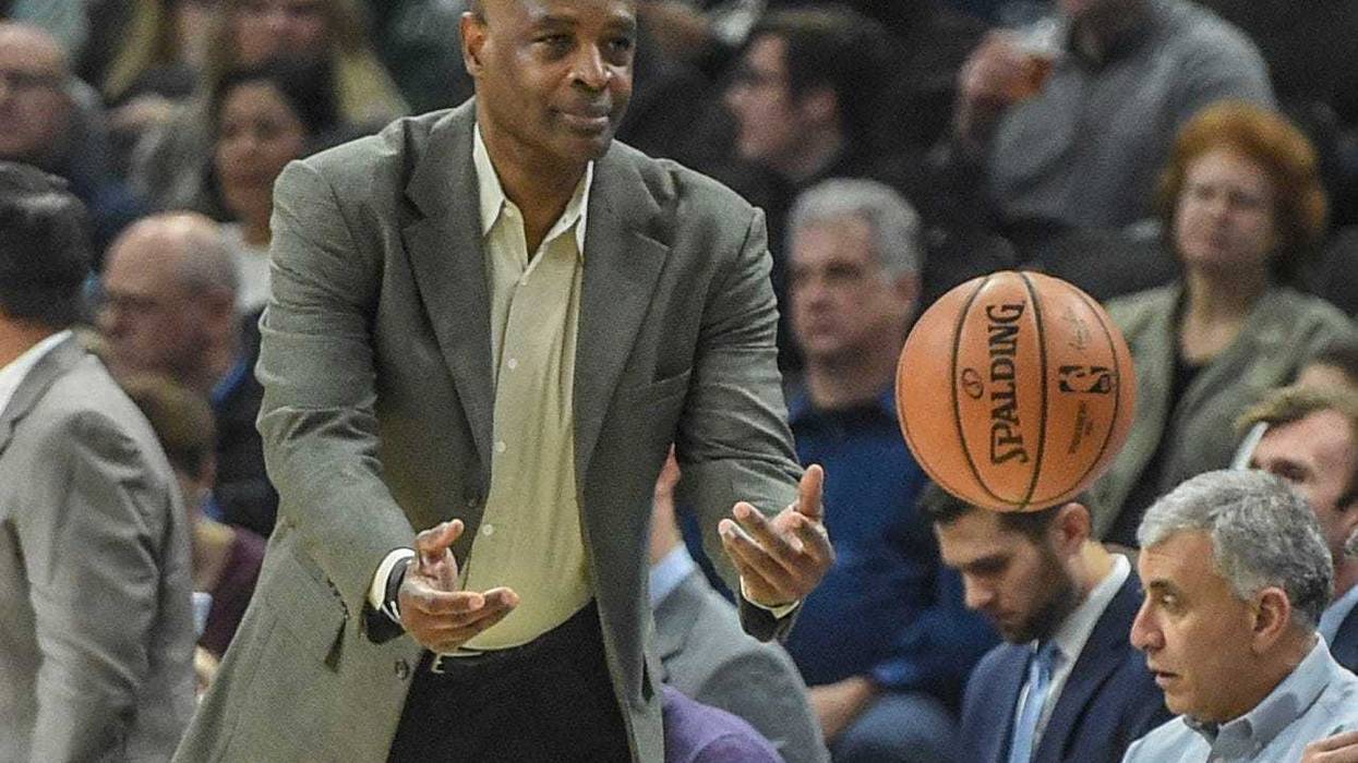 Dec 10, 2018; Milwaukee, WI, USA; Cleveland Cavaliers head coach Larry Drew tosses the ball back in play in the first quarter during the game against the Milwaukee Bucks at the Fiserv Forum. Mandatory Credit: Benny Sieu-USA TODAY Sports