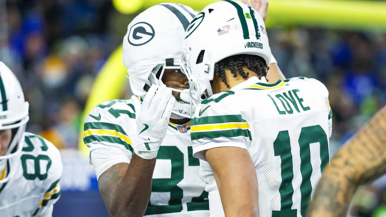 Dec 15, 2024; Seattle, Washington, USA; Green Bay Packers wide receiver Romeo Doubs (87) celebrates with Green Bay Packers quarterback Jordan Love (10) following a touchdown pass against the Seattle Seahawks during the fourth quarter at Lumen Field. Mandatory Credit: Joe Nicholson-Imagn Images