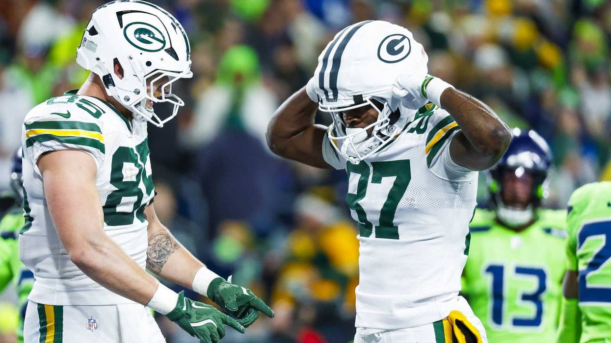 Dec 15, 2024; Seattle, Washington, USA; Green Bay Packers wide receiver Romeo Doubs (87) celebrates with tight end Tucker Kraft (85) after catching a touchdown pass against the Seattle Seahawks during the first quarter at Lumen Field. Mandatory Credit: Joe Nicholson-Imagn Images