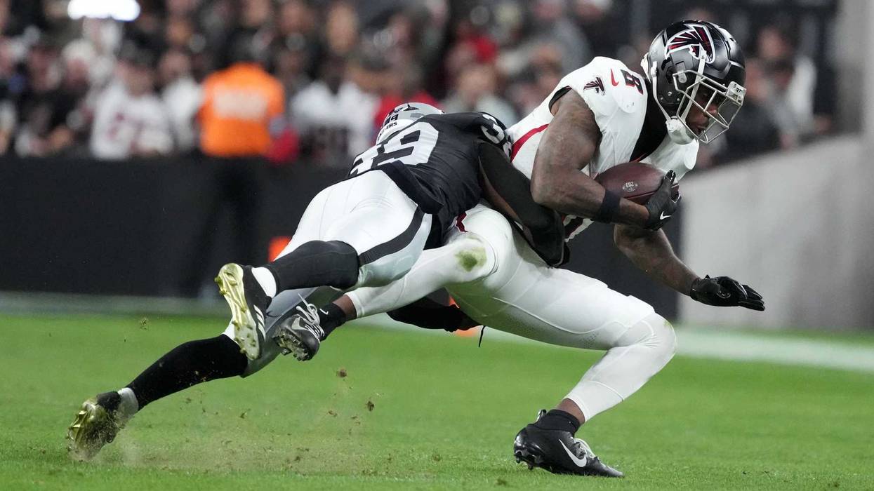 Dec 16, 2024; Paradise, Nevada, USA; Atlanta Falcons tight end Kyle Pitts (8) is tackled by Las Vegas Raiders cornerback Nate Hobbs (39) in the second half at Allegiant Stadium. Mandatory Credit: Kirby Lee-Imagn Images