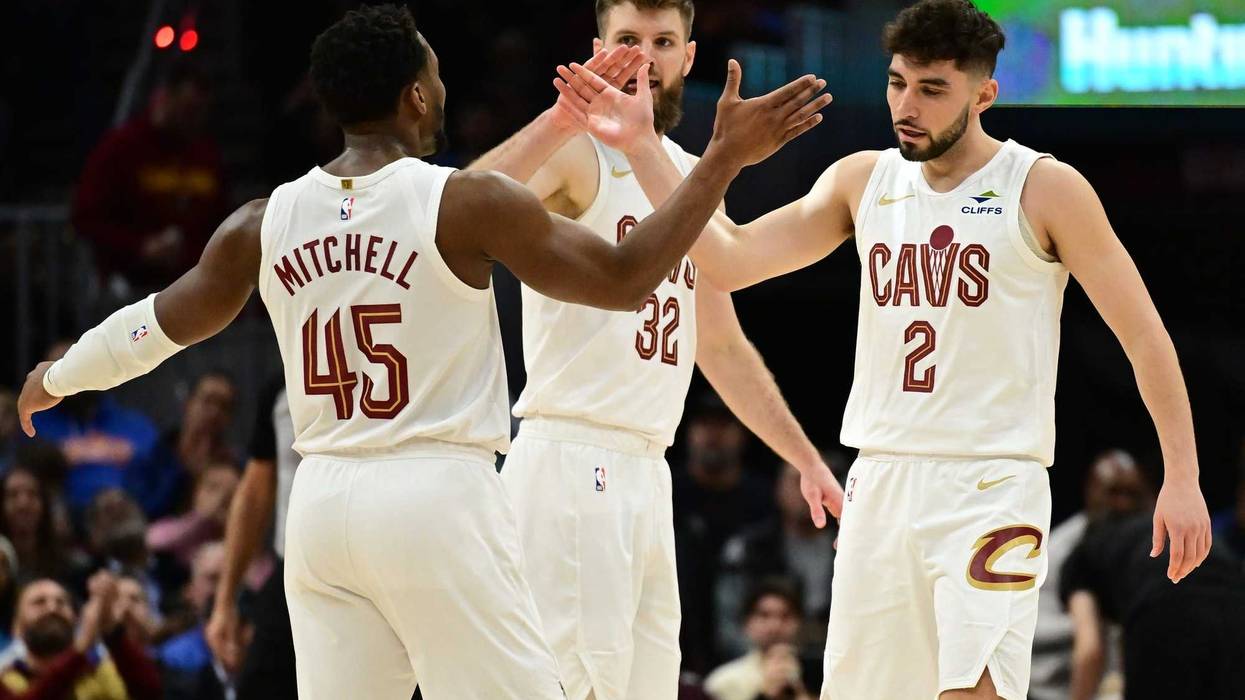 Dec 20, 2024; Cleveland, Ohio, USA; Cleveland Cavaliers guard Ty Jerome (2) celebrates with guard Donovan Mitchell (45) after hitting a three point basket during the first half against the Milwaukee Bucks at Rocket Mortgage FieldHouse.